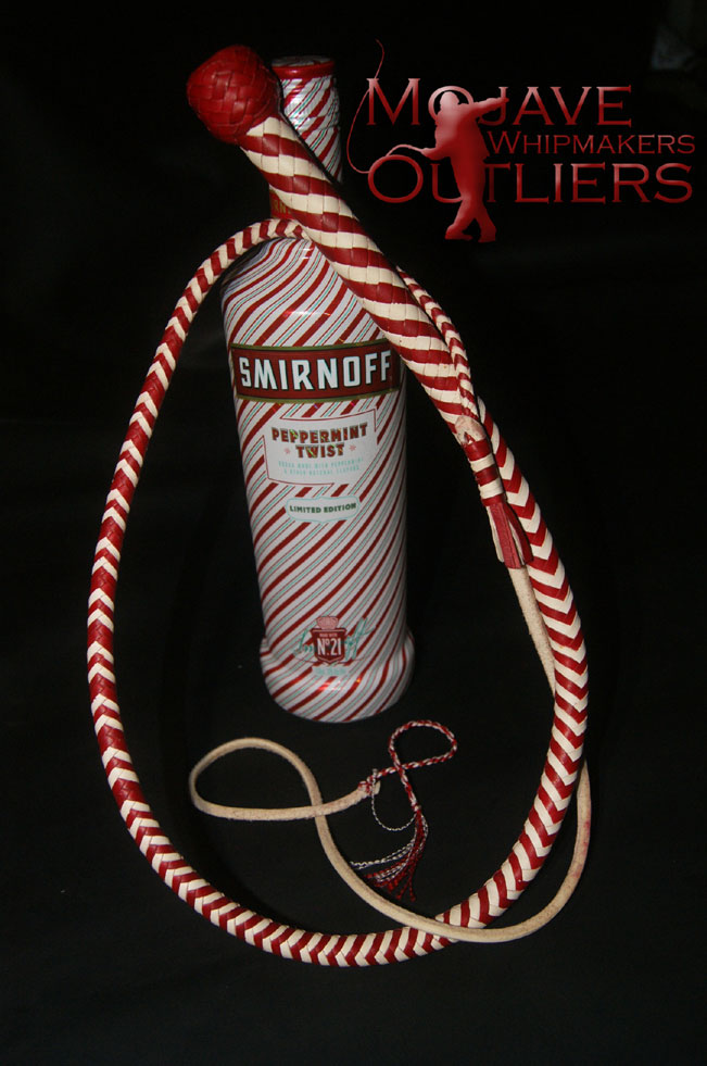 And just to give you an idea what's possible, a whimsical confection in red and white kangaroo leather:  The Candy Cane whip!  This one has an upcharge to it, mind you, because the white leather is falconry grade kangaroo hide.